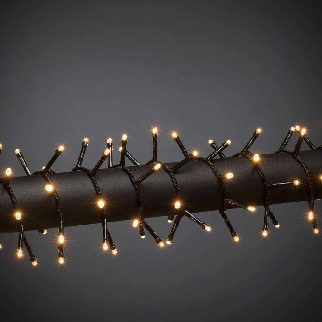 Cluster-lysslynge utendørs – 600 LED – Amber-Julebelysning juletrelys ute-Konstsmide-Svart-3868-800-Lightup.no